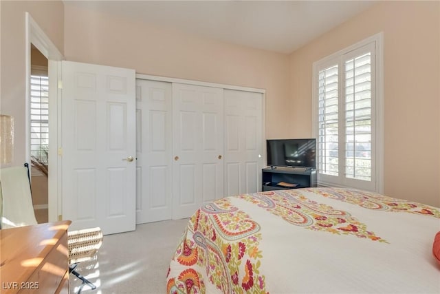 carpeted bedroom with a closet