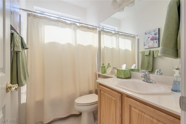 bathroom with toilet, shower / tub combo with curtain, vanity, and tile patterned flooring