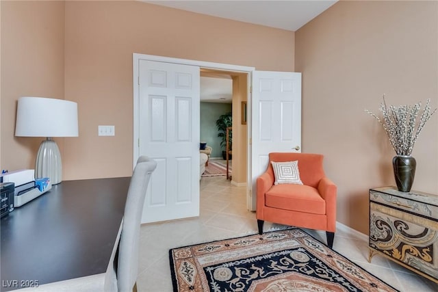 office area with light tile patterned floors and baseboards