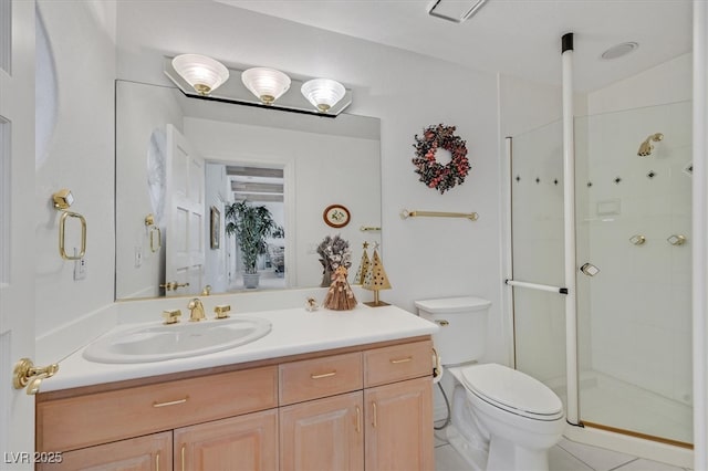 full bath featuring toilet, a stall shower, and vanity