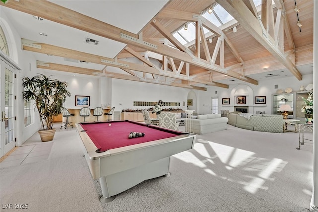 playroom with high vaulted ceiling, a skylight, beam ceiling, and billiards