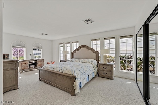 bedroom with carpet and visible vents