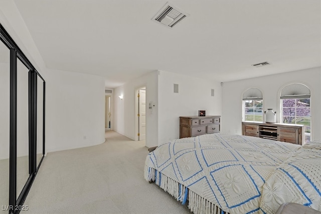 carpeted bedroom featuring wine cooler and visible vents