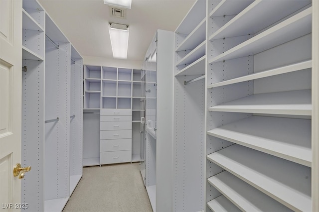 walk in closet with carpet and visible vents