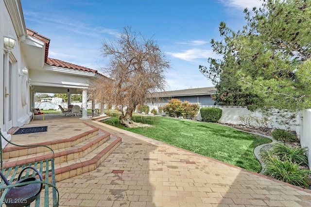 view of patio / terrace featuring fence