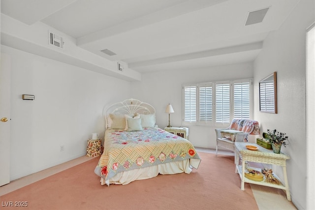 bedroom with visible vents and carpet flooring