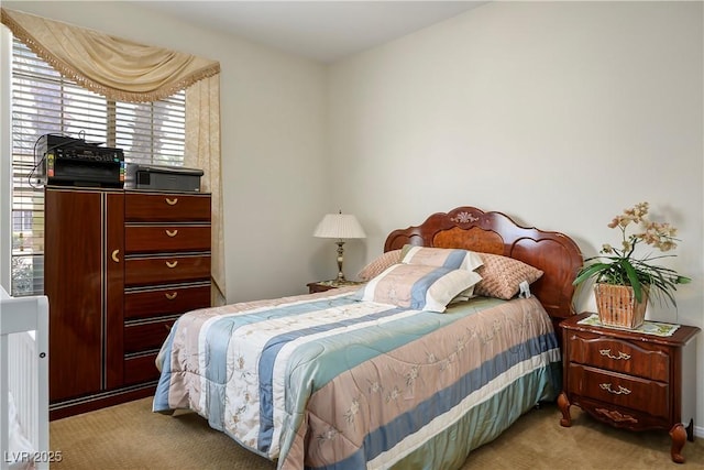 bedroom with light carpet