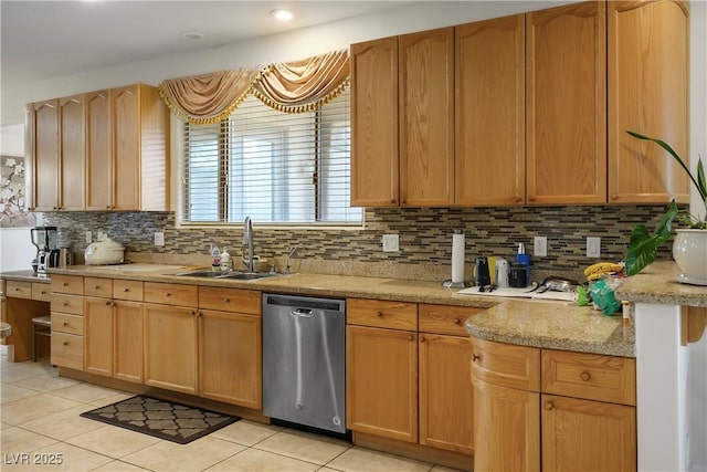 kitchen featuring dishwasher, backsplash, light tile patterned flooring, and a sink