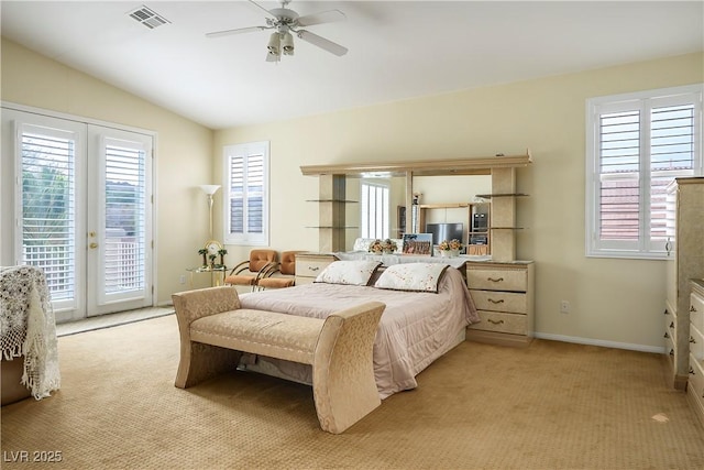 bedroom featuring vaulted ceiling, access to outside, french doors, and light colored carpet