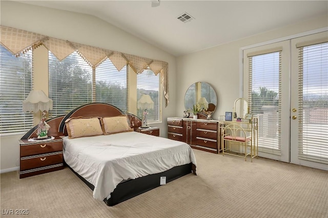 bedroom with lofted ceiling, carpet flooring, visible vents, access to outside, and french doors