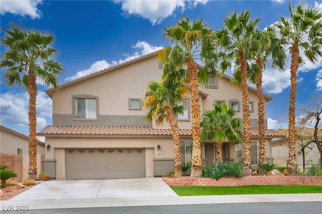 view of front of house with a garage, driveway, and stucco siding