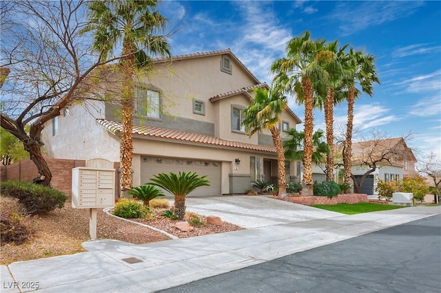 mediterranean / spanish house featuring driveway, a tile roof, a garage, and stucco siding