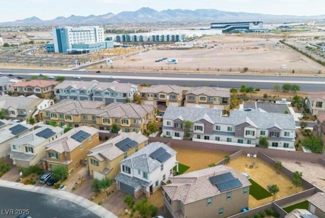 drone / aerial view with a residential view and a mountain view