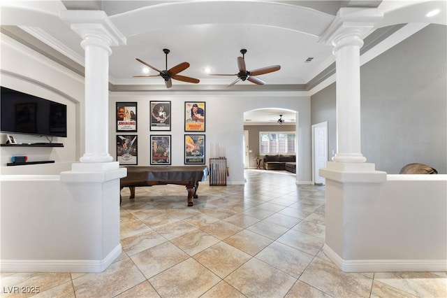 living area with arched walkways, a ceiling fan, visible vents, decorative columns, and crown molding