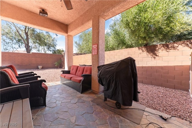 view of patio with a fenced backyard, a grill, and an outdoor living space