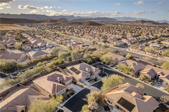 birds eye view of property featuring a mountain view and a residential view