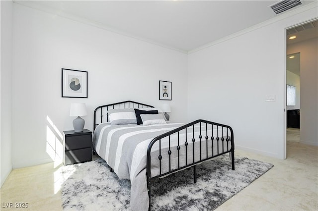 carpeted bedroom with visible vents, crown molding, and baseboards