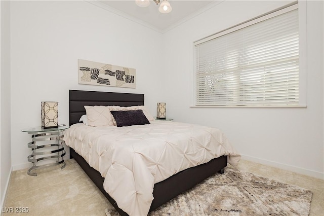 bedroom with carpet floors, baseboards, and crown molding