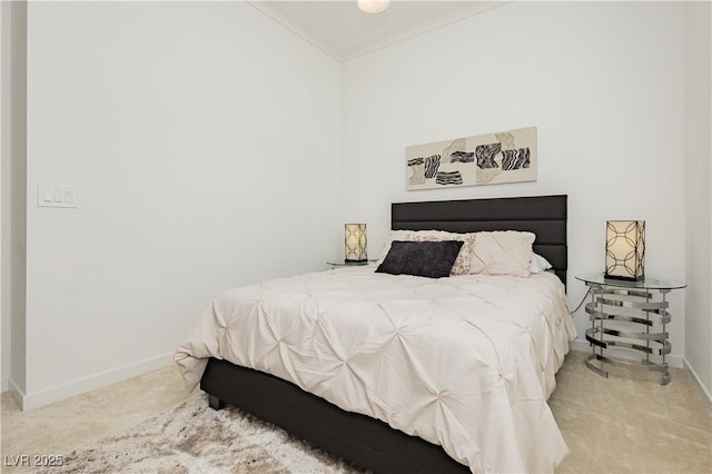 carpeted bedroom featuring ornamental molding and baseboards