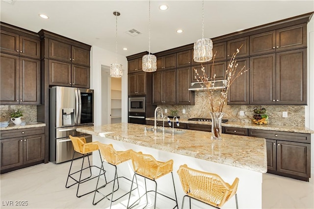 kitchen with visible vents, marble finish floor, stainless steel appliances, dark brown cabinets, and a sink