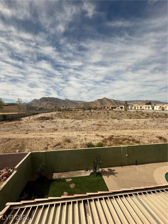 view of yard with a patio area and a mountain view