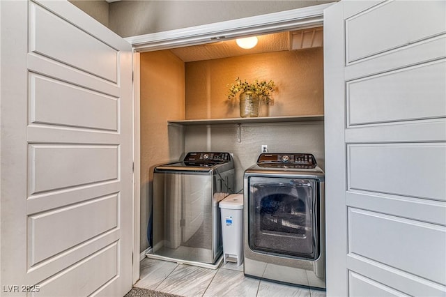 clothes washing area with laundry area and independent washer and dryer