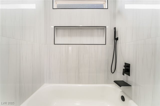 bathroom with shower / bath combination