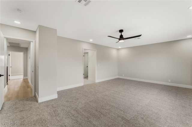 unfurnished room featuring ceiling fan, recessed lighting, light carpet, visible vents, and baseboards