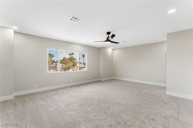 carpeted spare room with recessed lighting, visible vents, ceiling fan, and baseboards