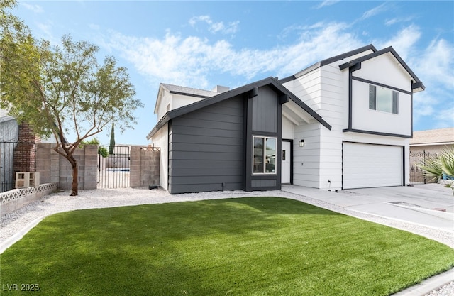 view of front facade with a garage, driveway, a gate, fence, and a front lawn