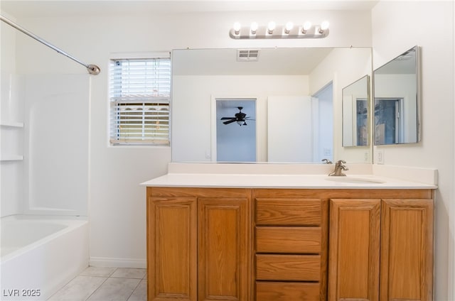 full bath with visible vents, tile patterned flooring, vanity, and bathing tub / shower combination