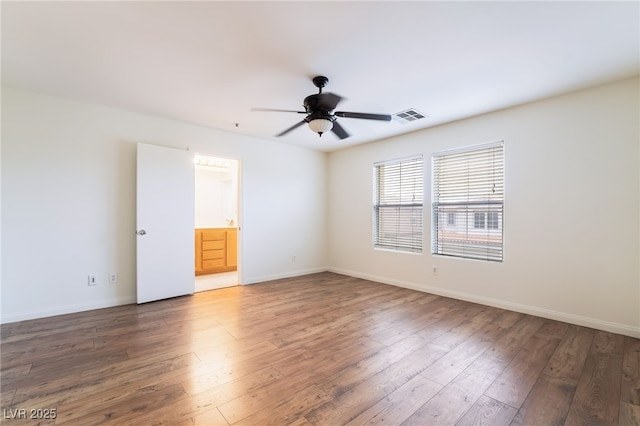 unfurnished room with light wood-type flooring, visible vents, ceiling fan, and baseboards