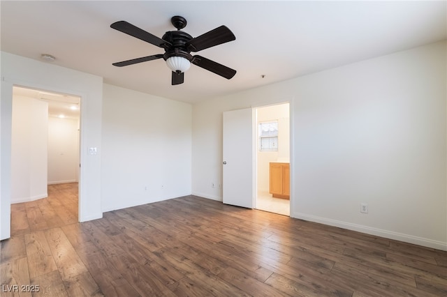 unfurnished room with ceiling fan, baseboards, and wood finished floors