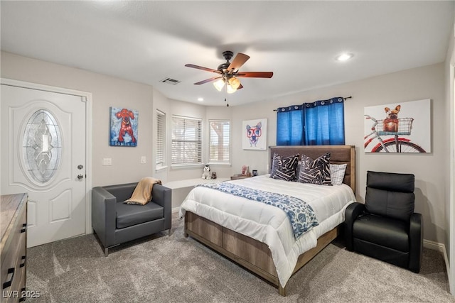 carpeted bedroom featuring recessed lighting, visible vents, and a ceiling fan