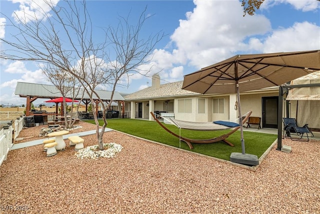 view of yard featuring a patio and fence