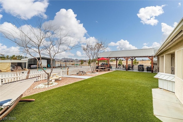 view of yard featuring a patio area and a fenced backyard