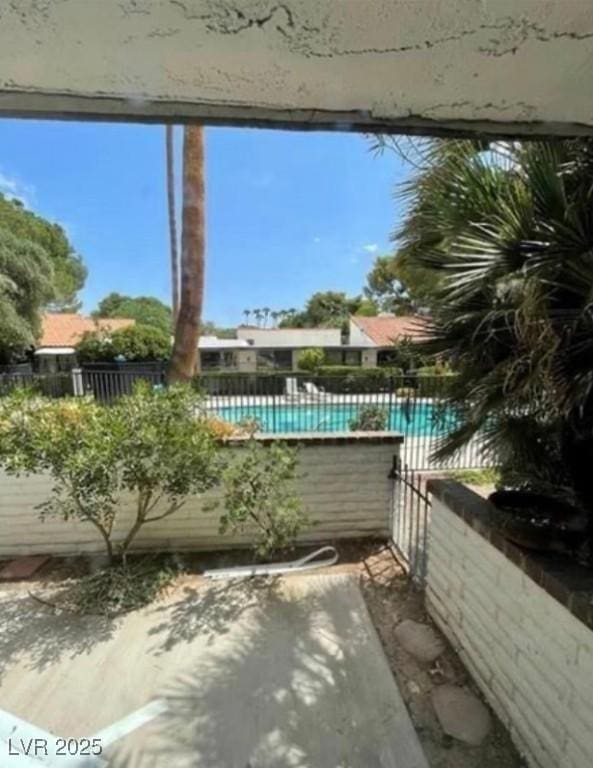 community pool featuring fence