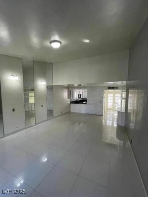 empty room with light tile patterned floors