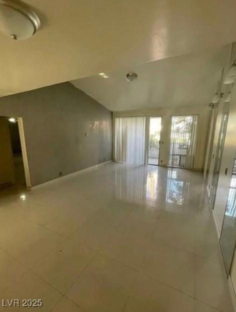 tiled empty room with baseboards