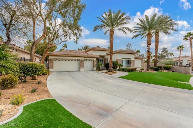 view of front of house with a garage, concrete driveway, stucco siding, fence, and a front yard