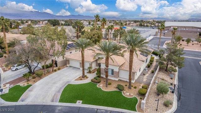 birds eye view of property with a residential view and a mountain view