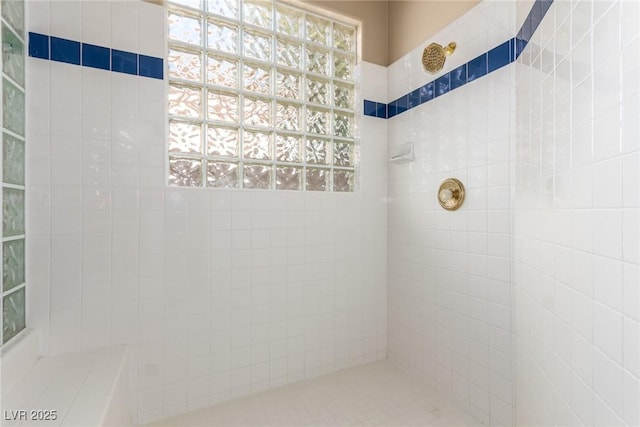 bathroom featuring tiled shower