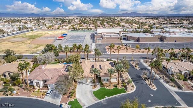 drone / aerial view with a residential view and a mountain view