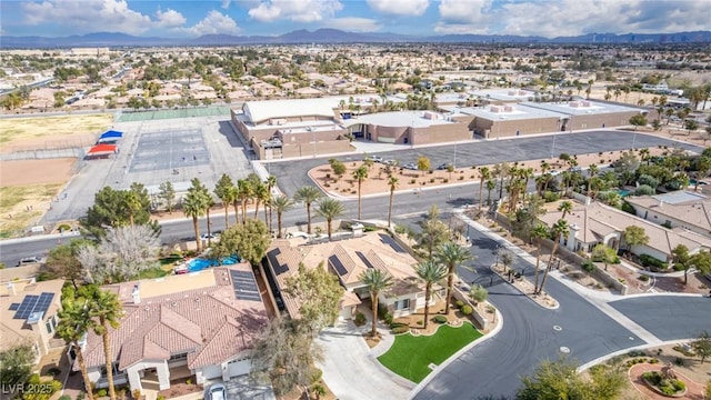 drone / aerial view featuring a residential view and a mountain view