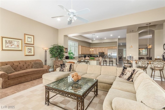 living room featuring ceiling fan and recessed lighting