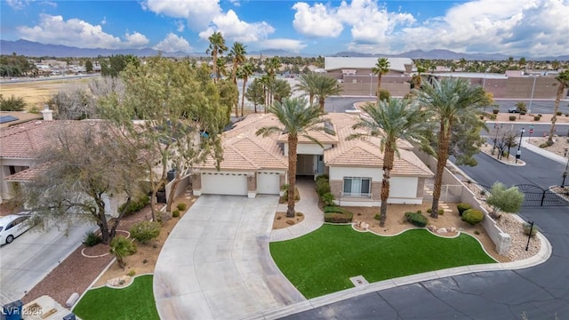 birds eye view of property with a mountain view