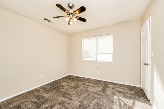 unfurnished room featuring visible vents, ceiling fan, and baseboards