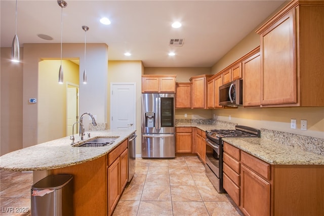 kitchen with stainless steel appliances, recessed lighting, visible vents, a sink, and light stone countertops