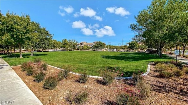 view of property's community featuring a lawn