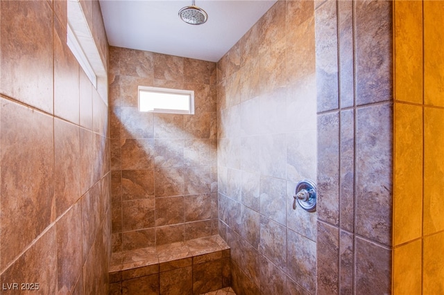 full bath featuring tiled shower